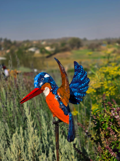 Handmade African kingfisher sculpture displayed outdoors in garden, recycled metal, weather-resistant